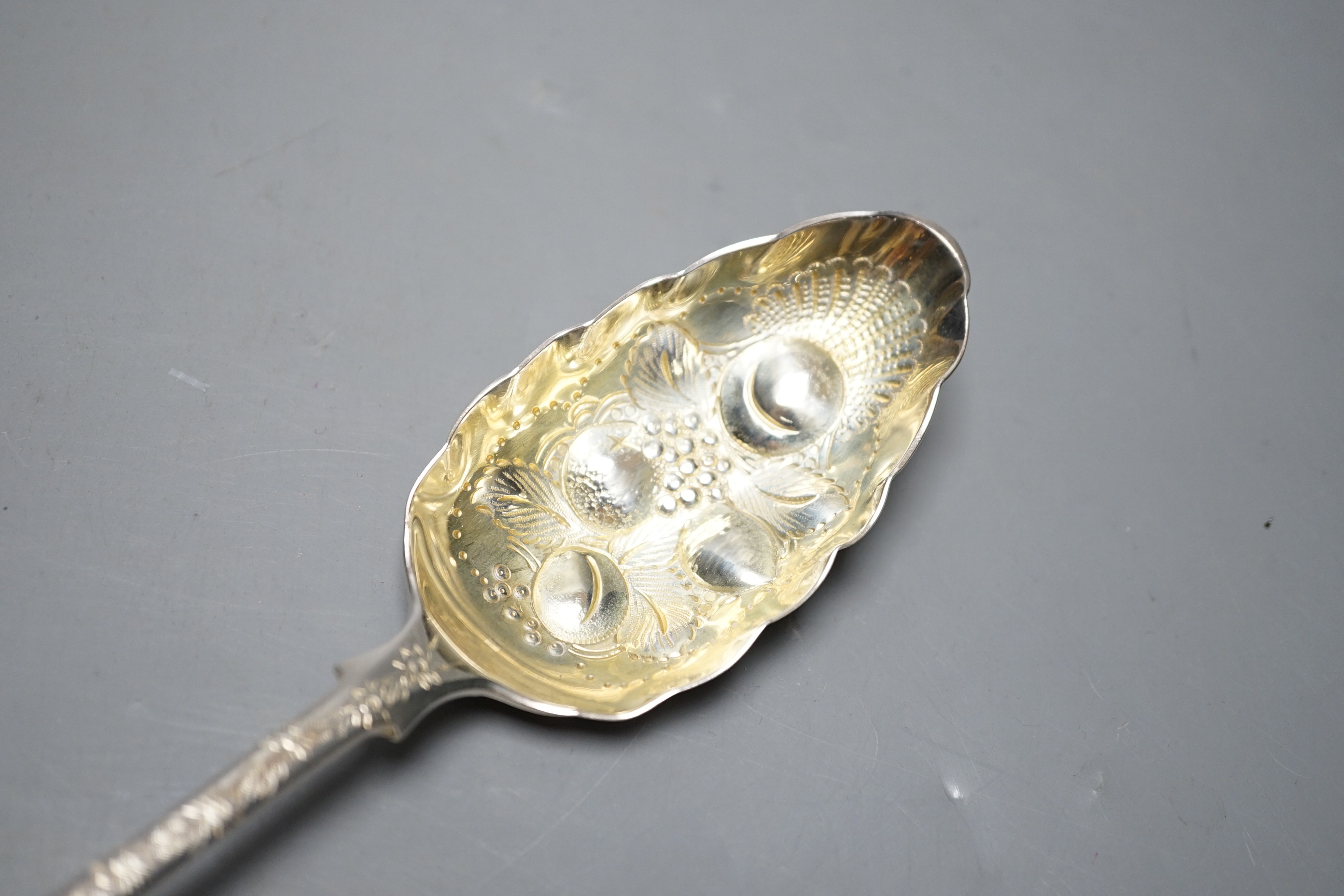 A late George III silver fiddle pattern embossed 'berry' basting spoon, Eley & Fearn, London, 1817, 30.6cm, 113 grams.